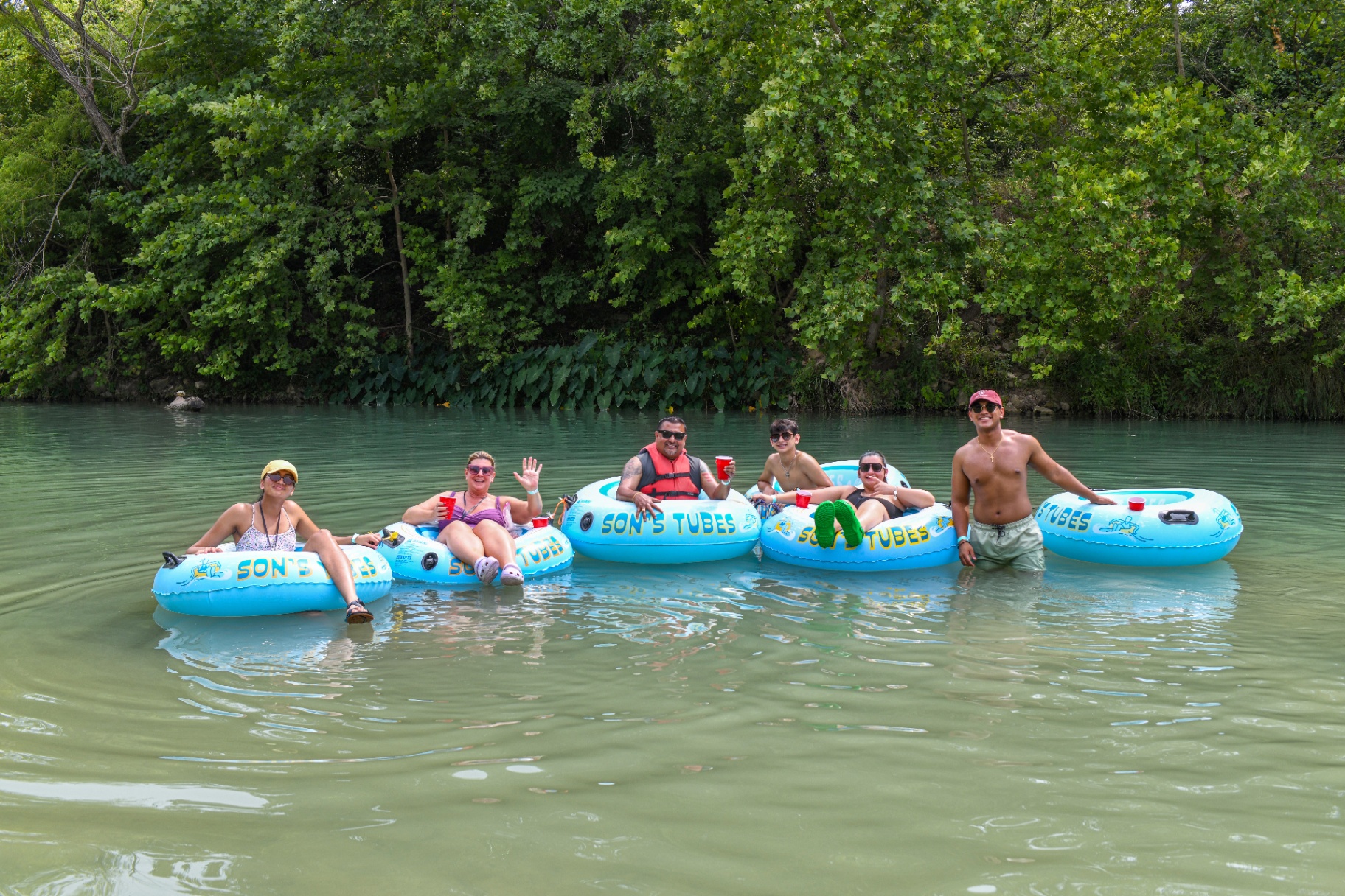 Friends tubing on the river