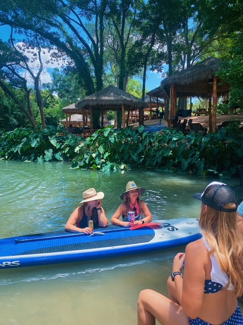 Friends relaxing on paddleboards