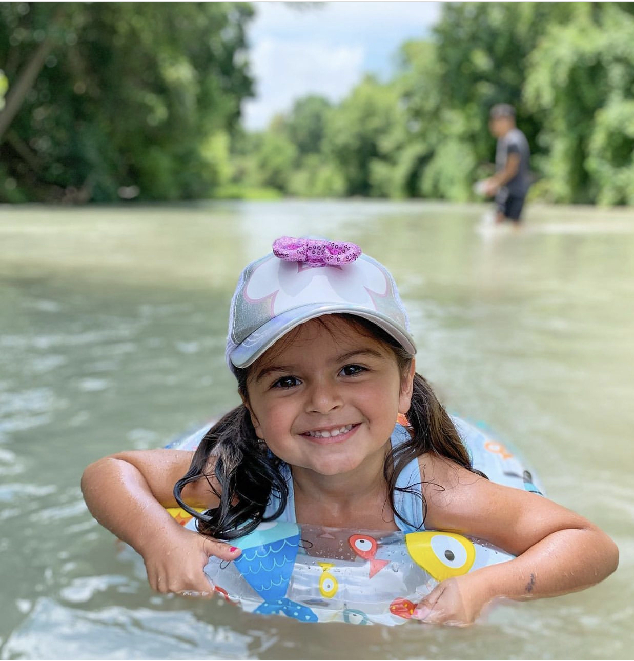 Girl tubing on the river