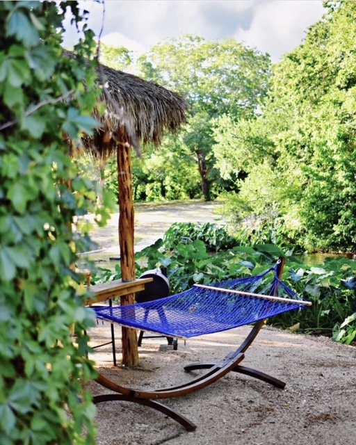Relaxing in a hammock by the creek